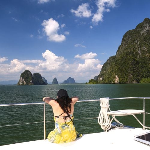 Woman enjoying sailing vacation on ycht charter Thailand coast