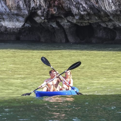 Thailand couple rowing on boat