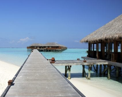 Maldives cabin by sea blue beach