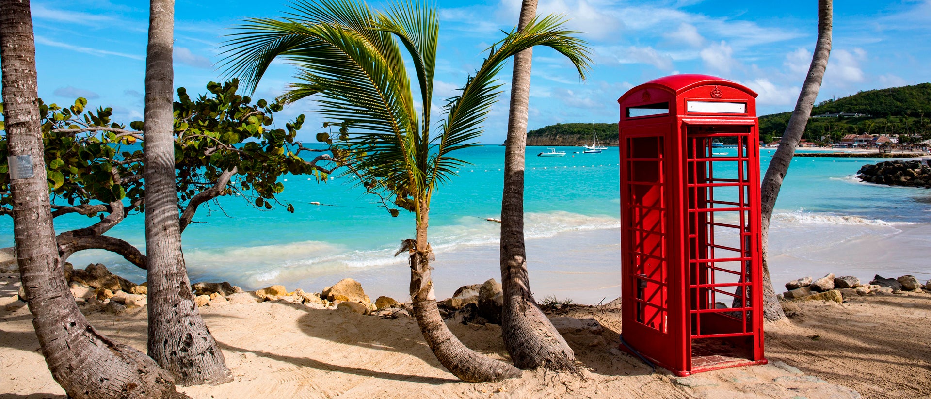 Antigua beach red telephone box palms
