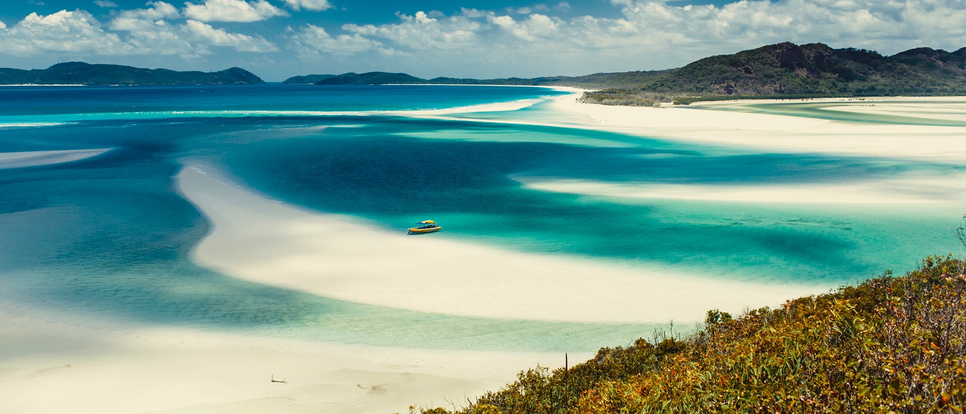 Whitesundays beach and boat anchored