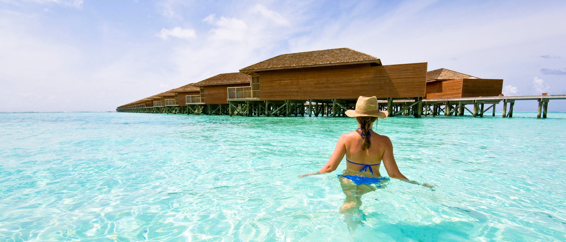 Maldives girl in water sea cabin summer vacation