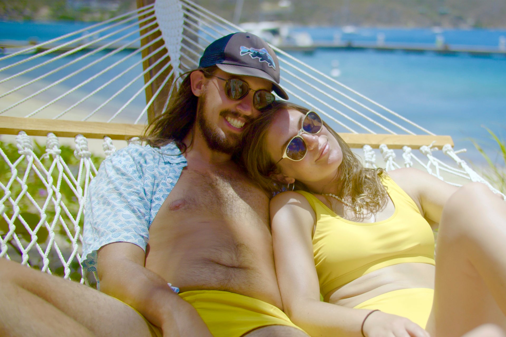 Grenada happy couple relaxing in beach vacation