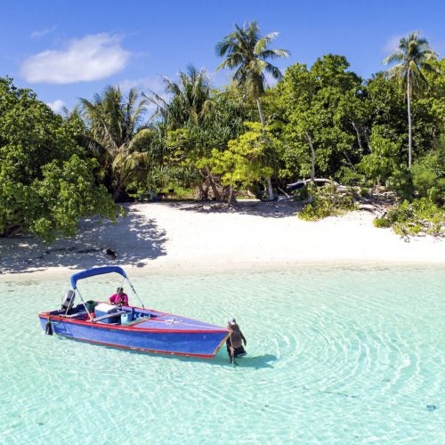 Tahiti sailboat crystal water beach palms