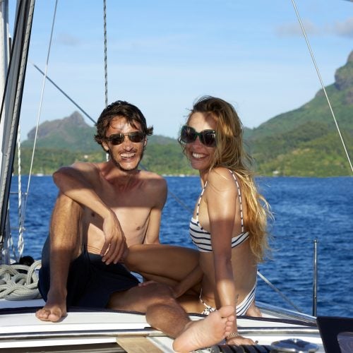 Tahiti happy couple sailing charter