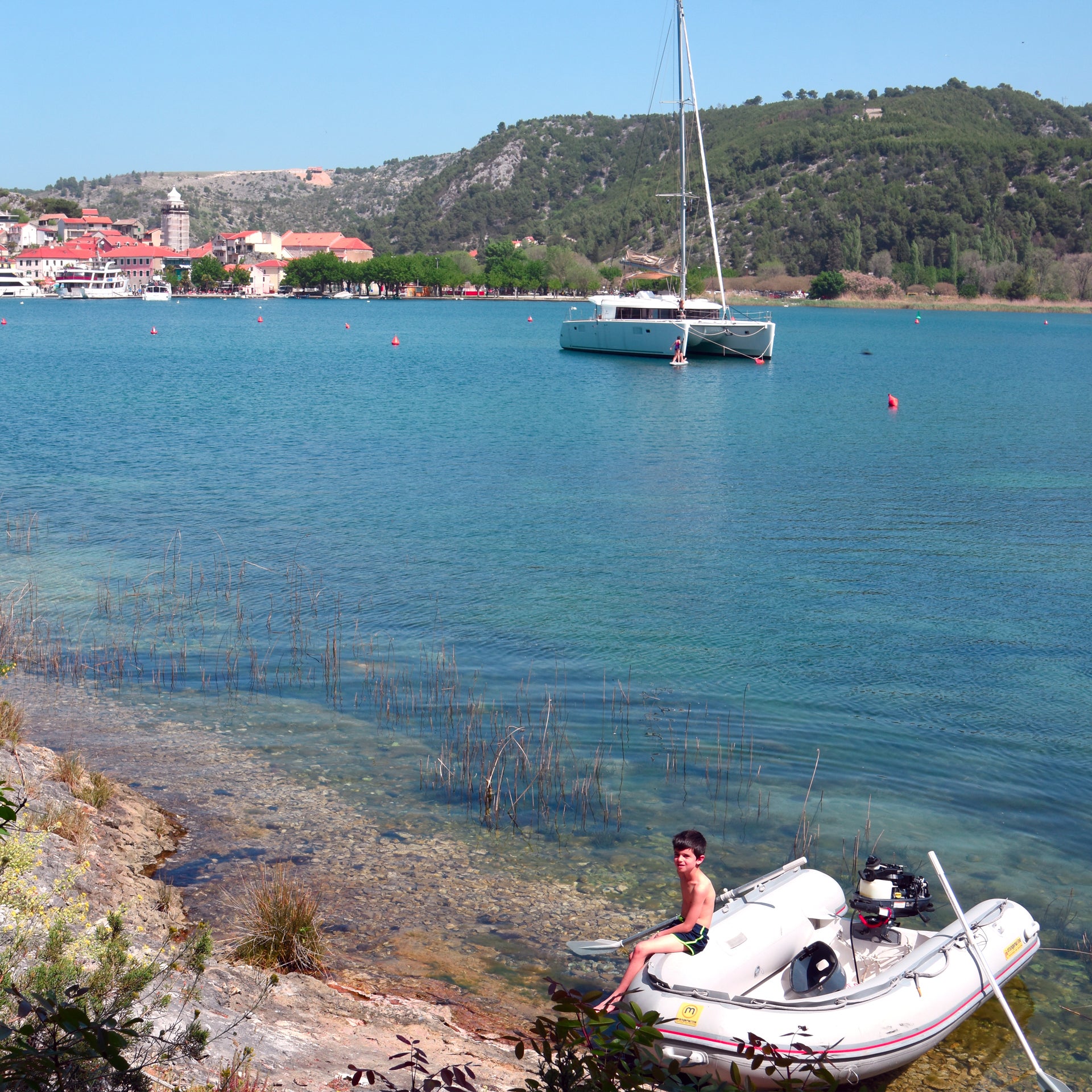 Croatia catamaran and zodiac boat in the sea