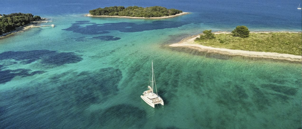 Croatia catamaran sailing in crystalline sea