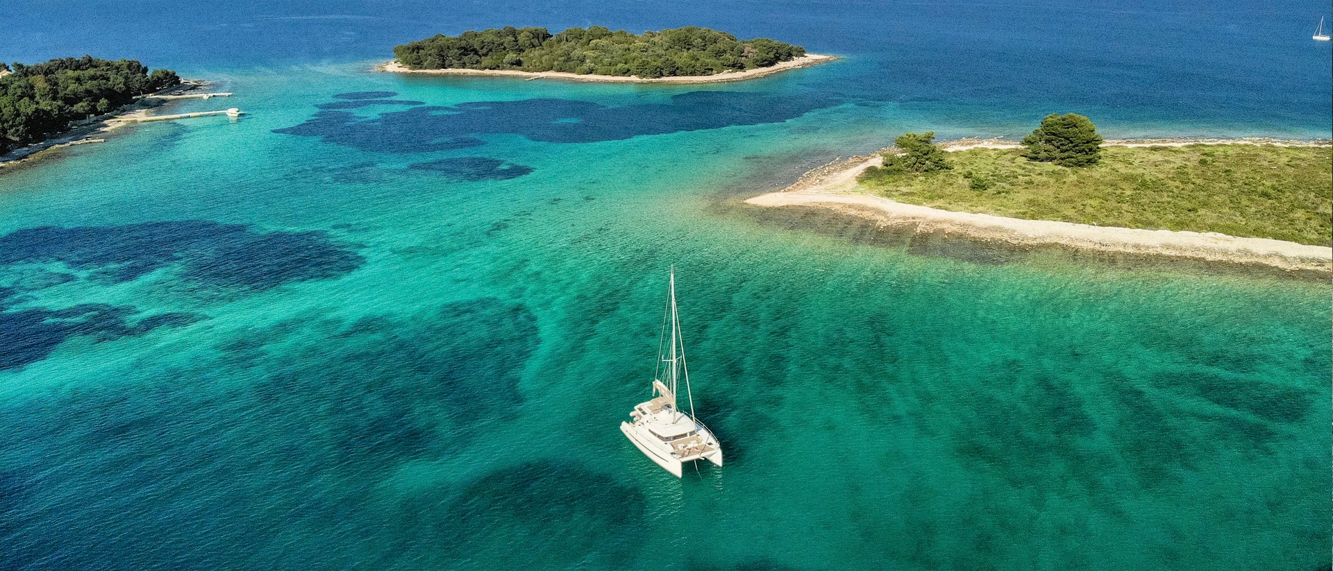 Croatia catamaran sailing in crystalline sea