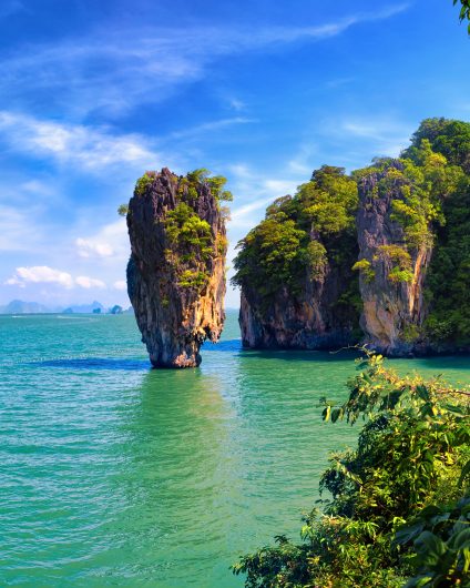 South East Asia towering island sea and yacht