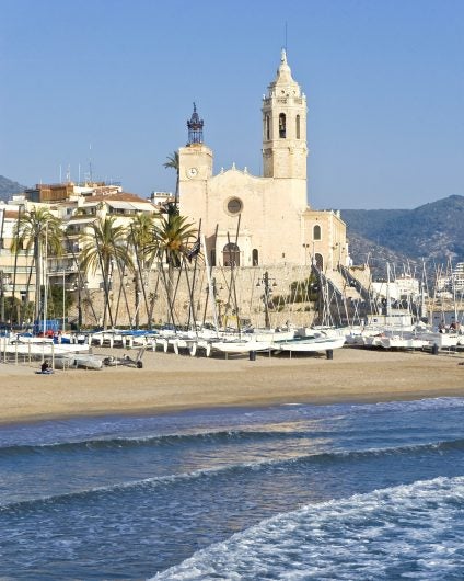 Spain Stiges church yachts at the beach
