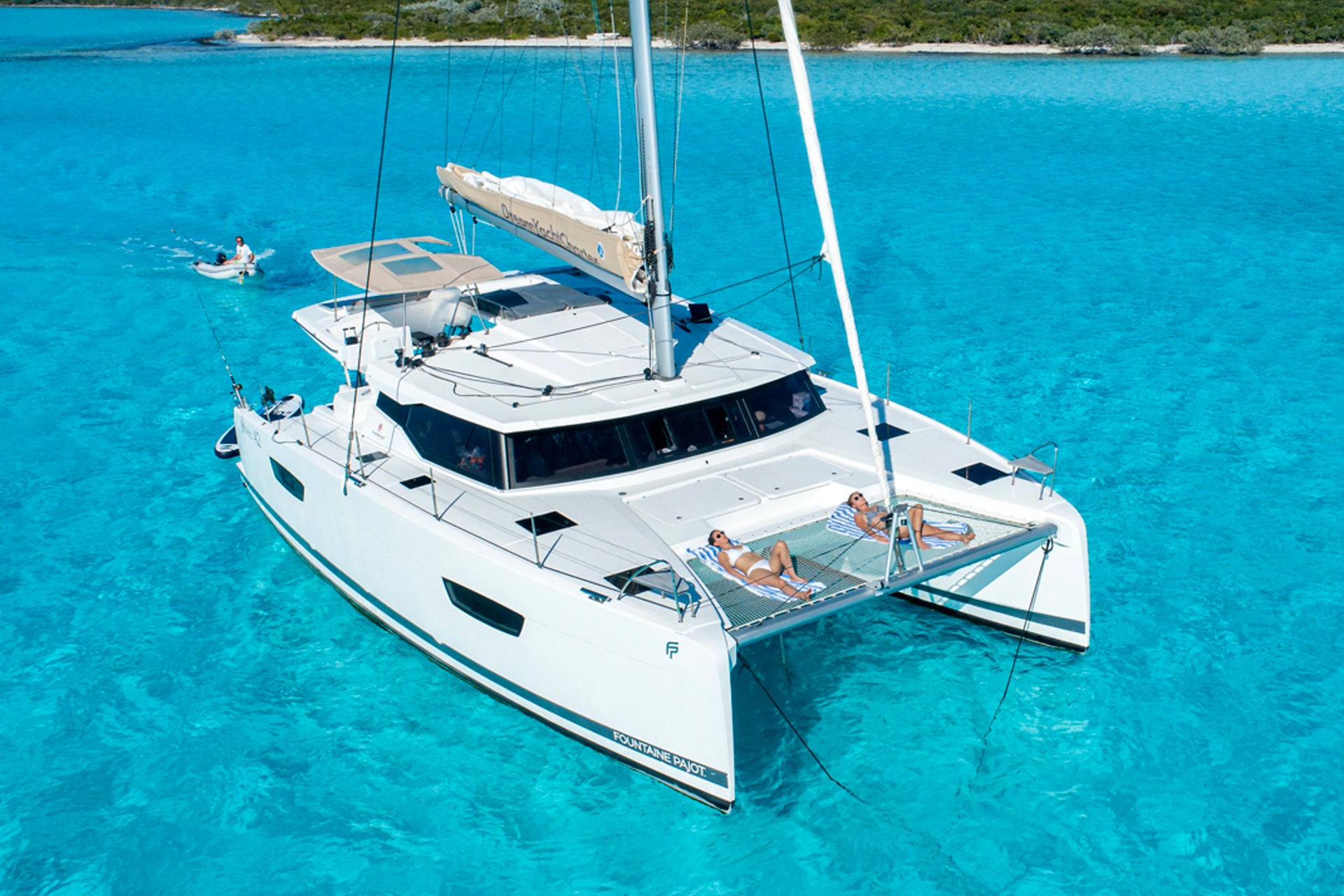 Catamaranbareboat yacht charter in blur crystal waters