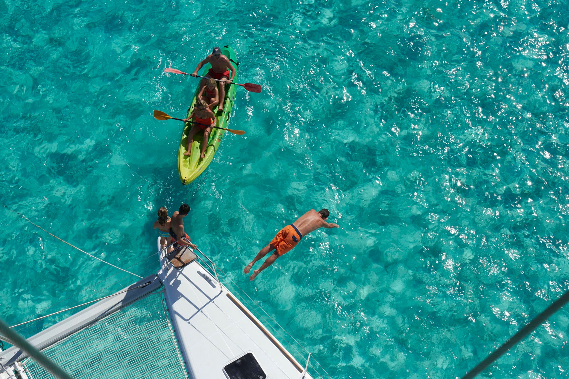 Group swimming in the sea and crewed yacht charter