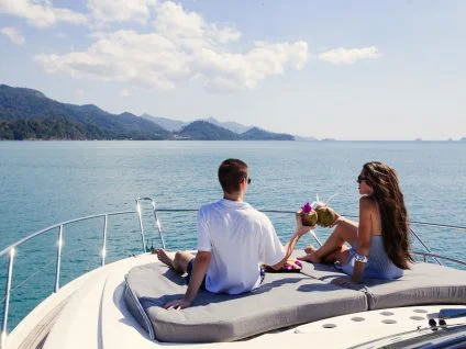 Couple sailing ina crewed fully yacht charter