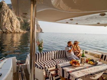 Couple enjoying on board of a yacht charter