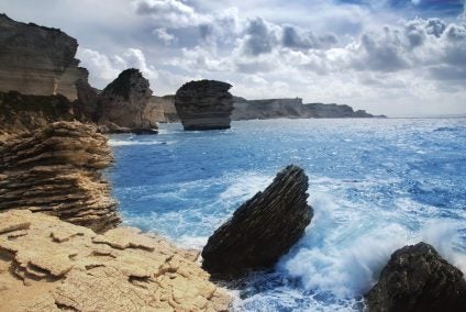 waves crashing onto the rocks of Corsica