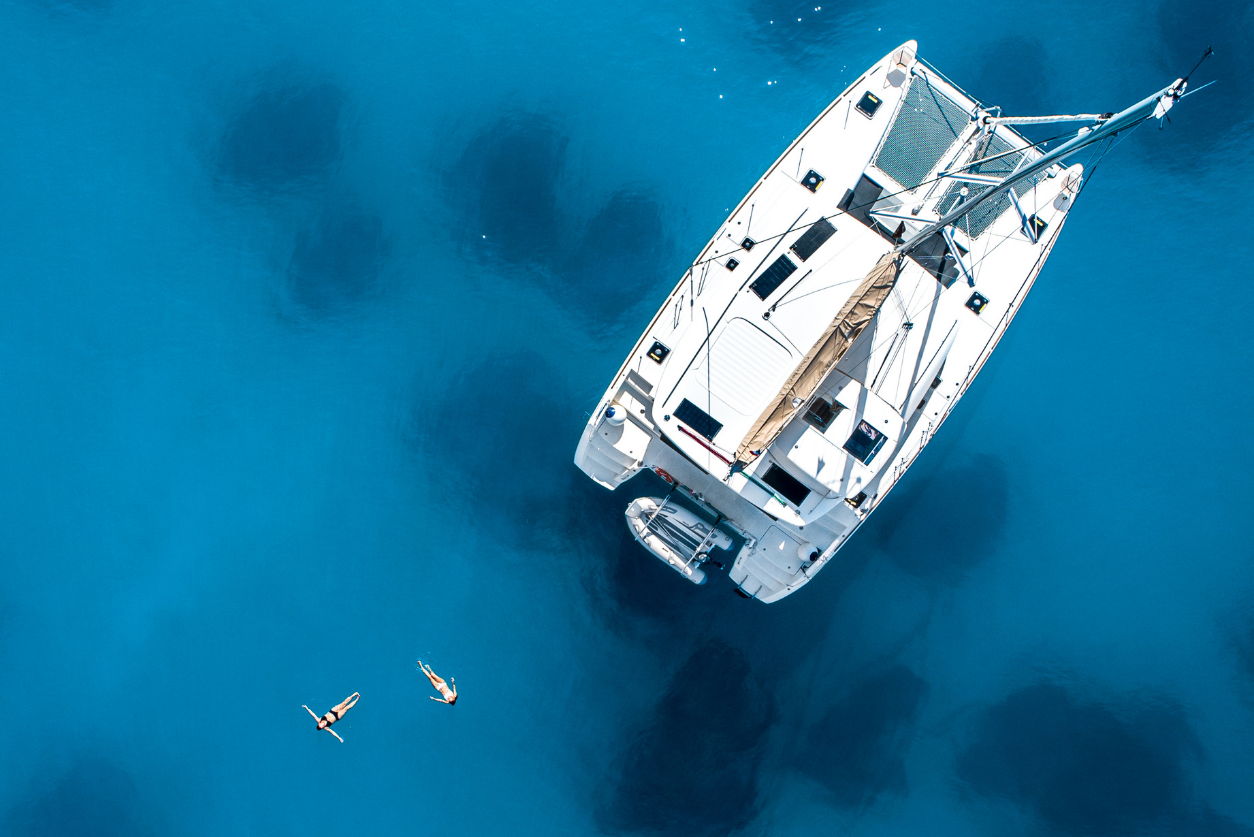 Catamaran yacht charter sailing in blue sea