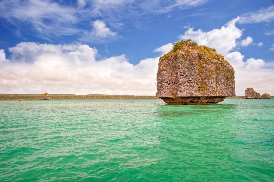 large rock island in the waters of New caledonia