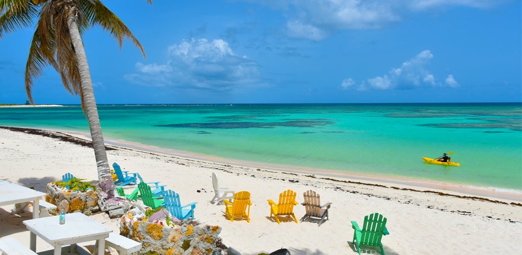 Sailing in the BVI - Pastel chairs in Anegada