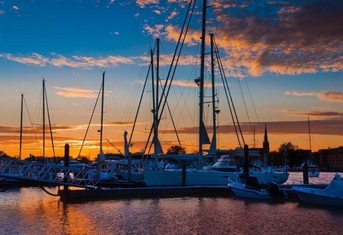 boats docked at sunset