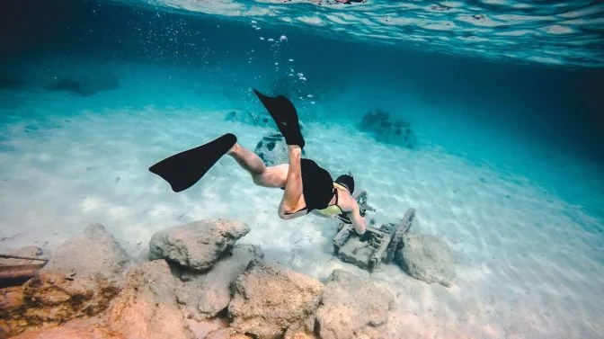 man snorkeling underwater in Mediterranean