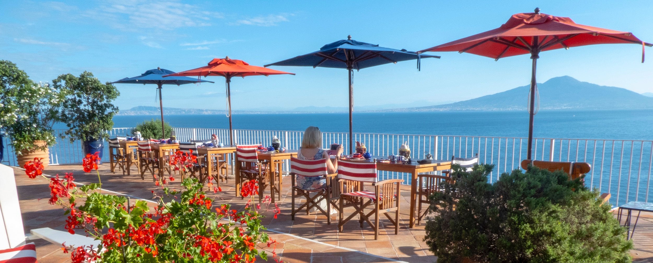 drinking coffee in Italy at table near waterfront