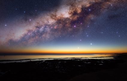 Starry night above the ocean