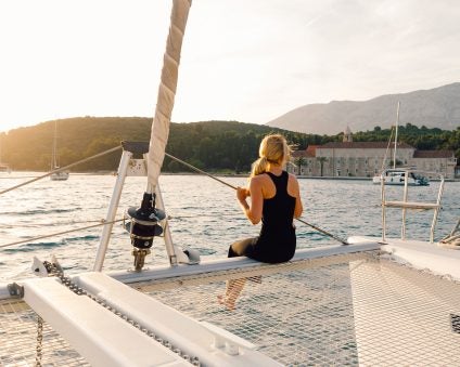 Mediterranean yacht charter woman on bow of boat