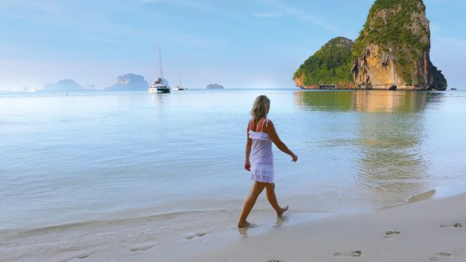 girl walking on thailand beach in andaman sea