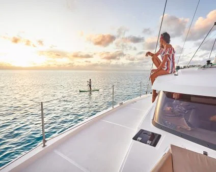 woman on boat in tahiti buying a yacht