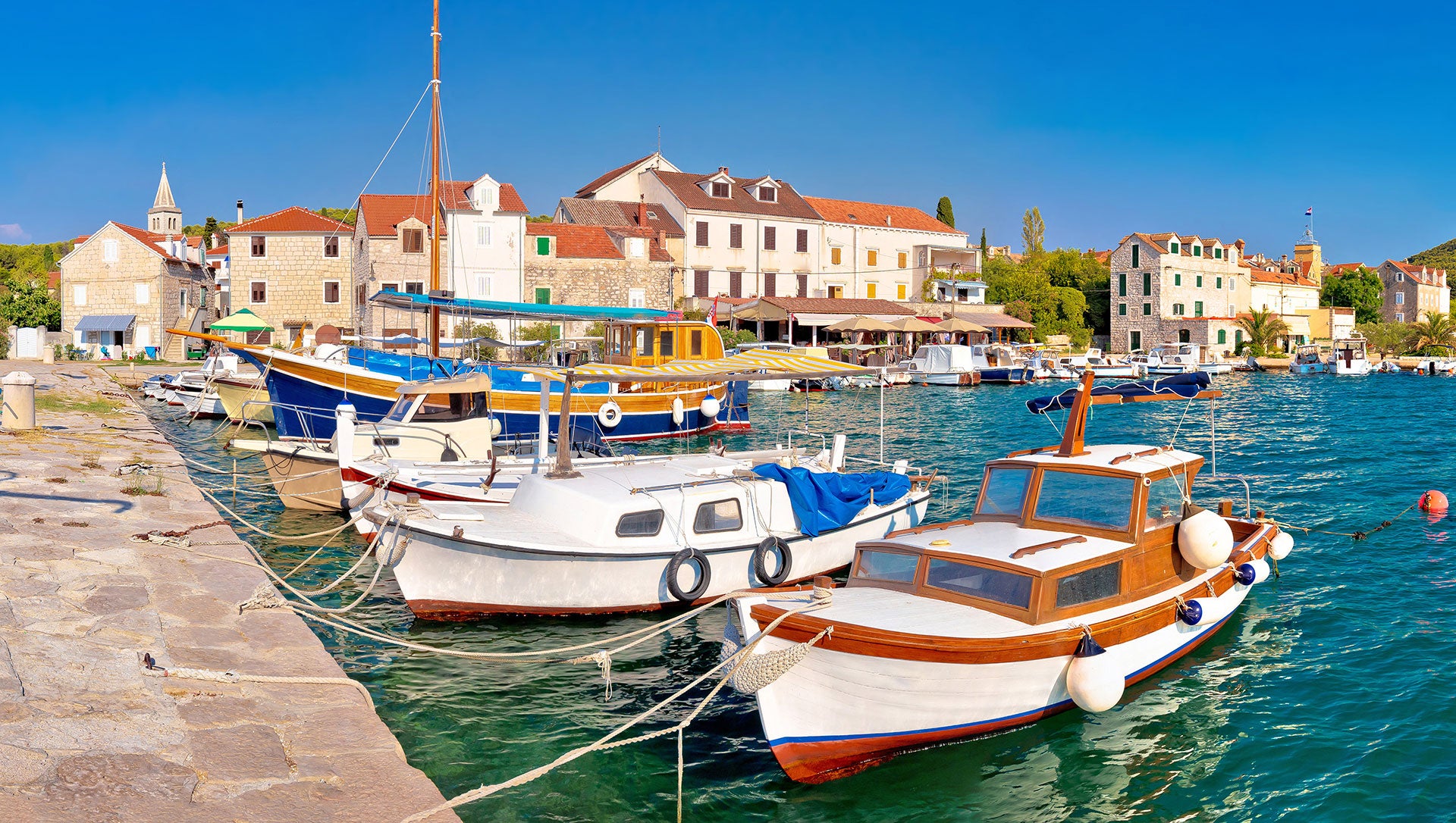 scenic harbor with wooden boats in Zlarin, a top croatia photo spot