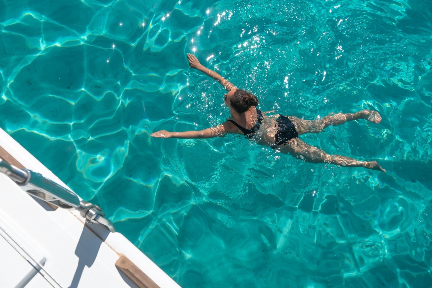 Swimming by the swim platform on a yacht
